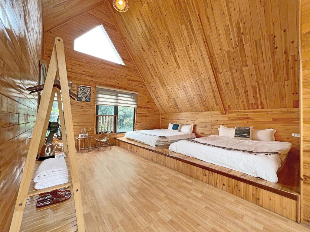Postel nebo postele na pokoji v ubytování Chapa Stream House