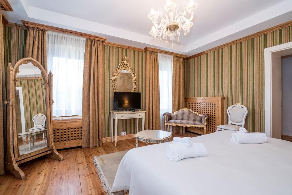Postel nebo postele na pokoji v ubytování Càdor Hotel