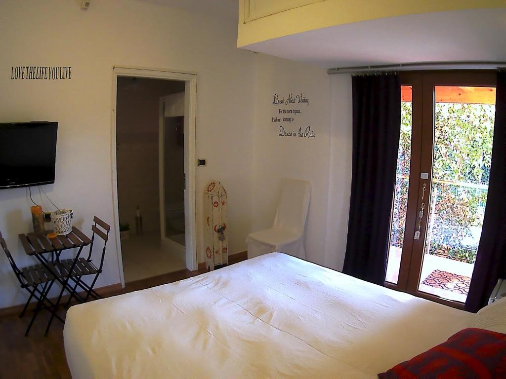Postel nebo postele na pokoji v ubytování B&B Albaluna