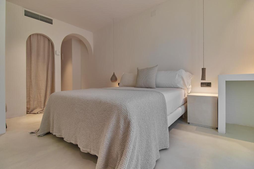 Postel nebo postele na pokoji v ubytování Hotel Avenida