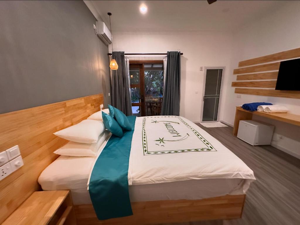 Postel nebo postele na pokoji v ubytování Dhigurah Beach Inn