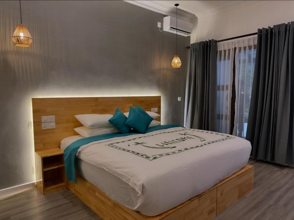 Postel nebo postele na pokoji v ubytování Dhigurah Beach Inn