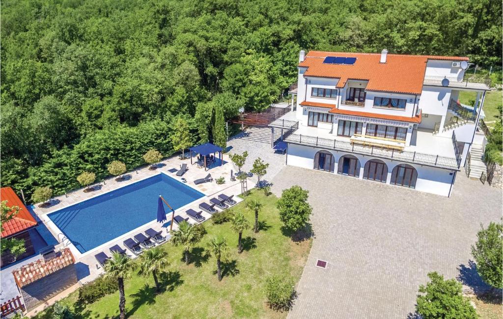 an aerial view of a house with a swimming pool at Nice Home In Bribir With Sauna in Bribir