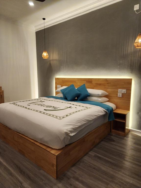Postel nebo postele na pokoji v ubytování Dhigurah Beach Inn