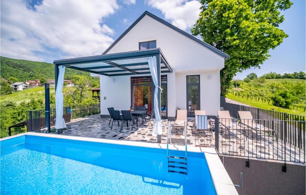 a villa with a swimming pool and a house at 4 Bedroom Nice Home In Ivancici in Ivančići