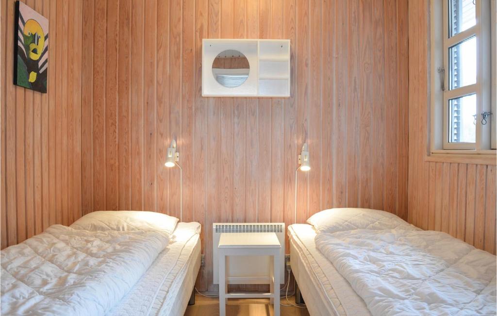 Postel nebo postele na pokoji v ubytování Holiday Home Fyrmarken Hvide Sande Iii