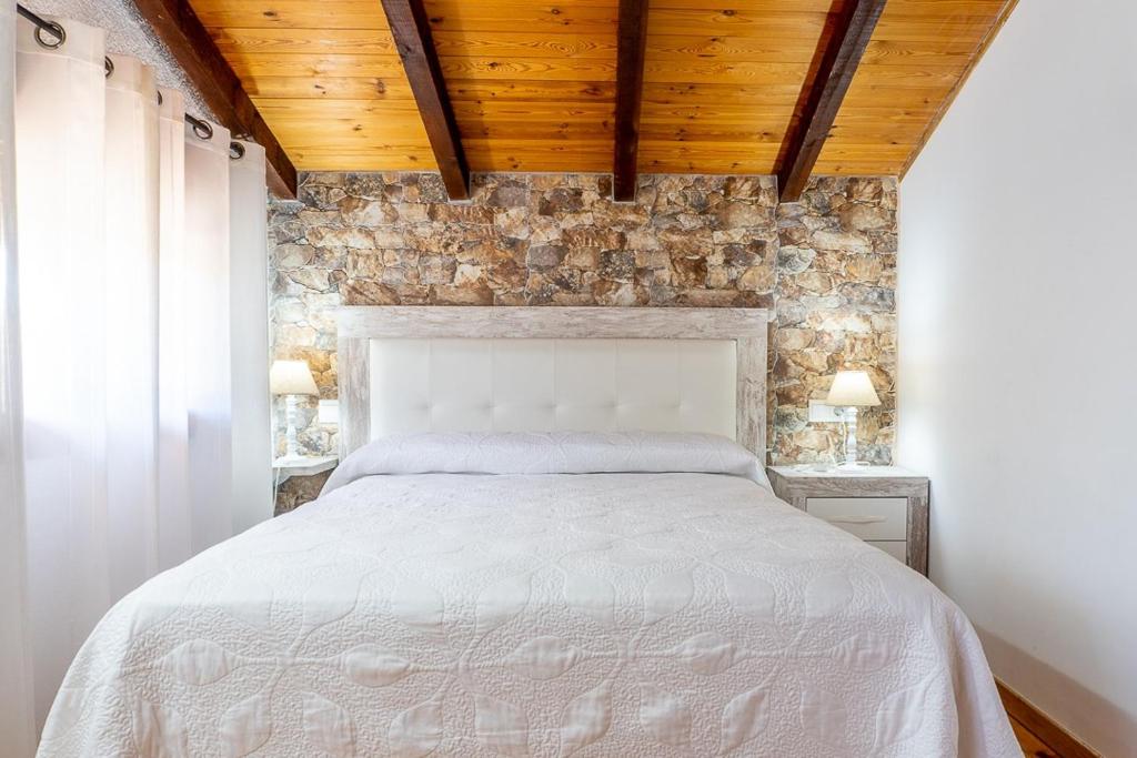 Postel nebo postele na pokoji v ubytování La Pedrera