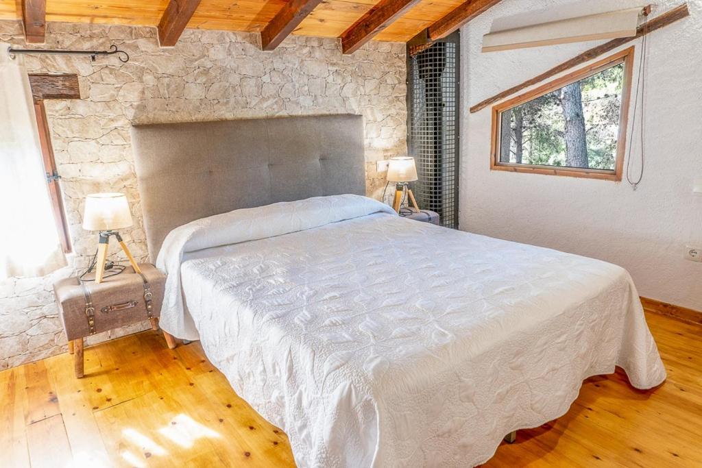 Postel nebo postele na pokoji v ubytování La Pedrera