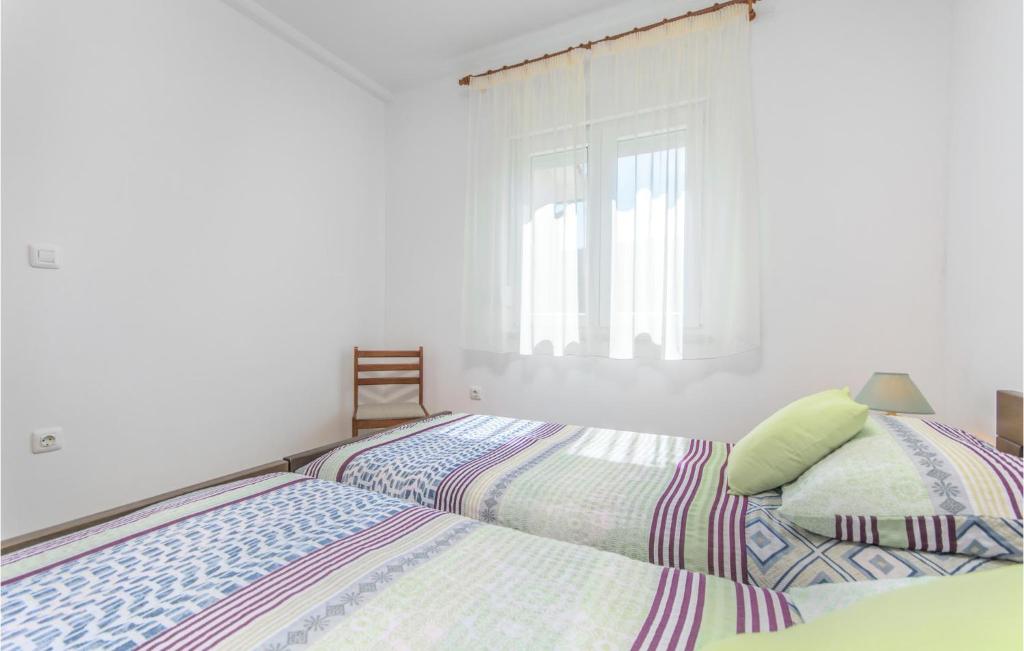 Postel nebo postele na pokoji v ubytování Apartment Marina Iv