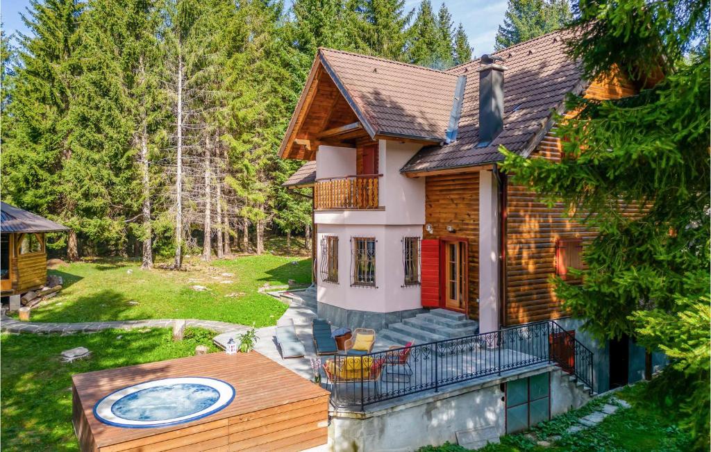 an aerial view of a log house with a deck at Stunning Home In Mrkopalj With Sauna in Mrkopalj