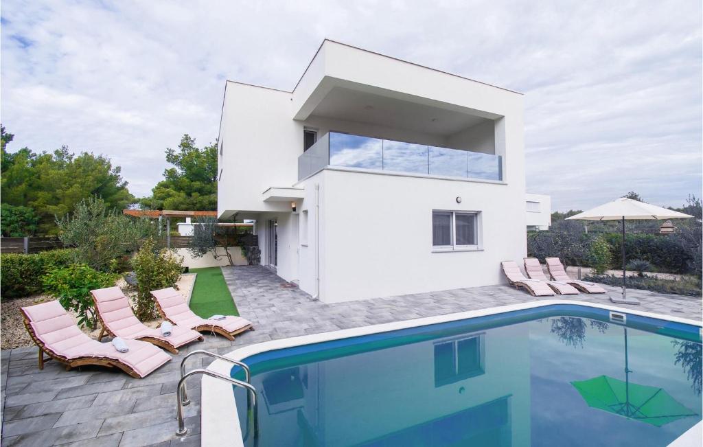 a villa with a swimming pool and a house at Cld688, Villa Vlahov I in Šibenik