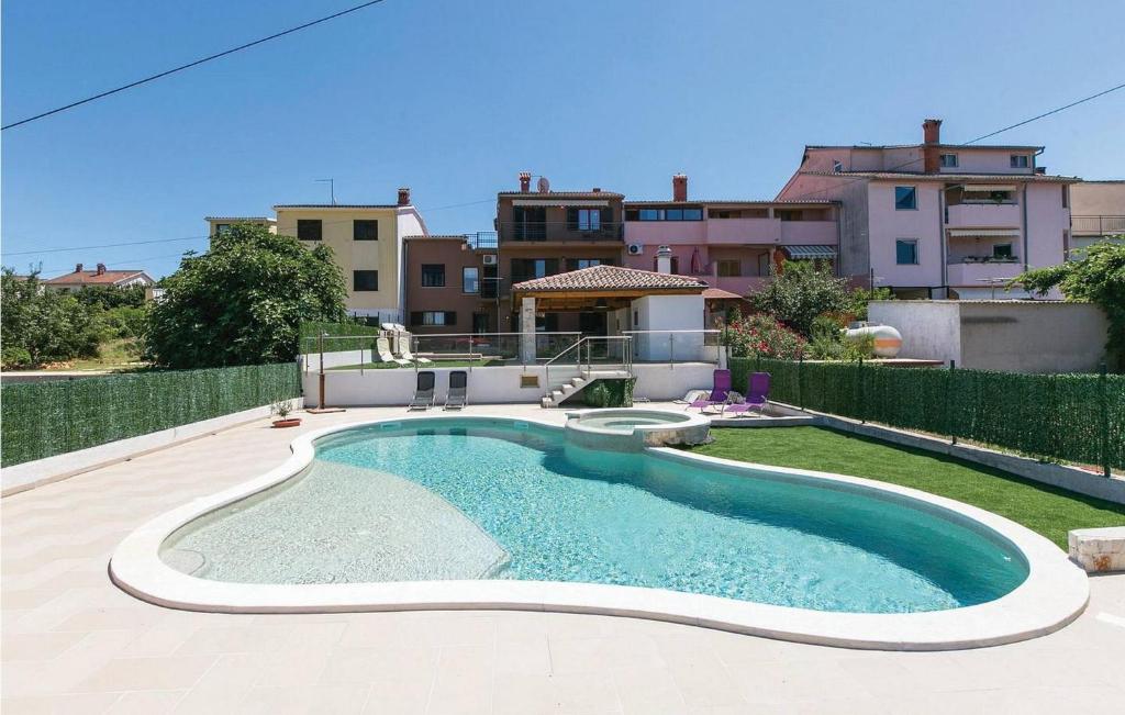 a swimming pool in the backyard of a house at House Sole in Pula