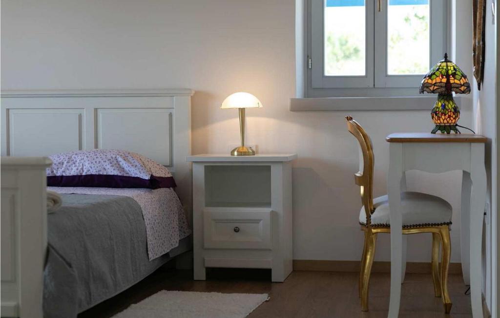 Postel nebo postele na pokoji v ubytování Villa Irena Funtana