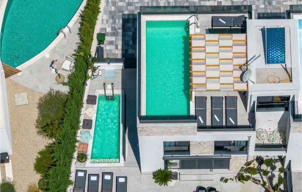 an overhead view of a building with a swimming pool at Beautiful Home In Srima in Srima