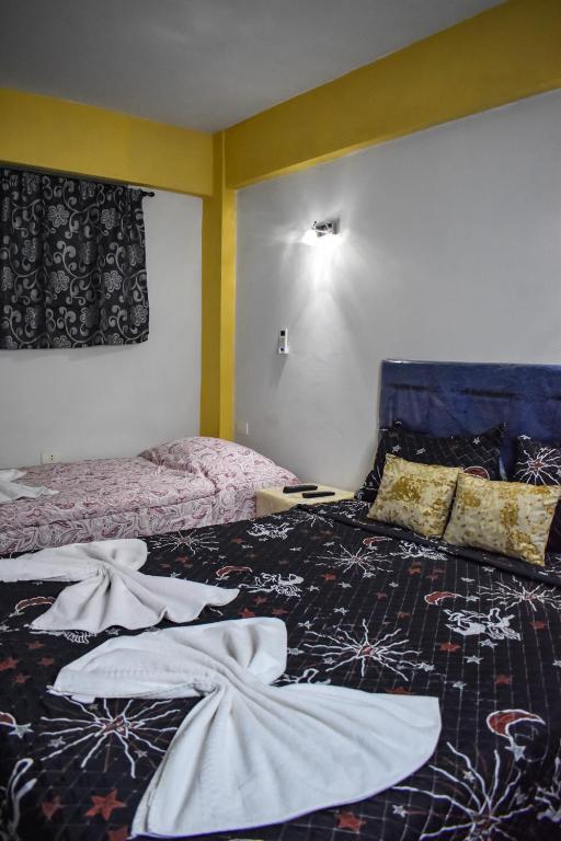 Postel nebo postele na pokoji v ubytování Ullanka Apart Hotel