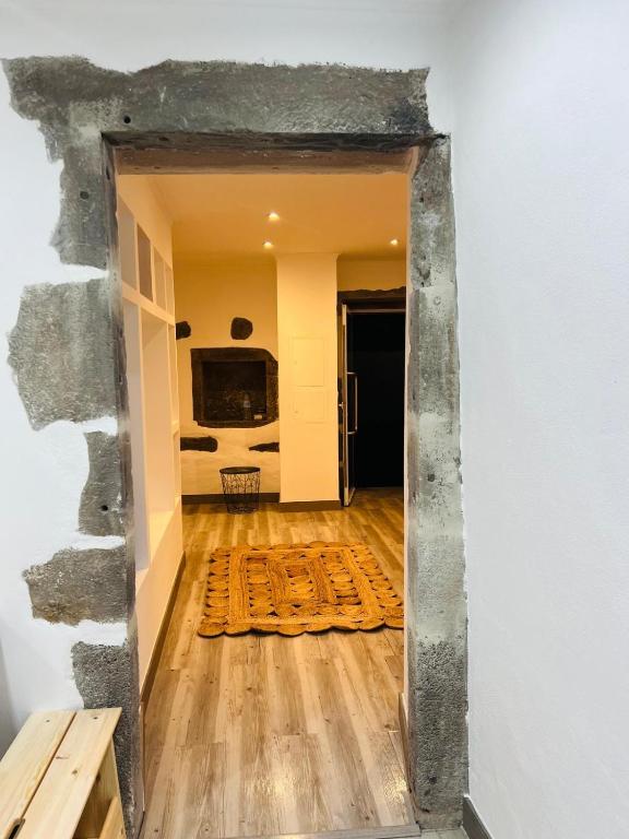 a view through a doorway into a room at Casa da Grota do Bravo in Nordeste