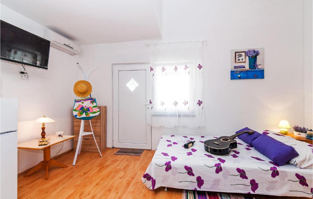 Posteľ alebo postele v izbe v ubytovaní Two-Bedroom Apartment In Vinjerac