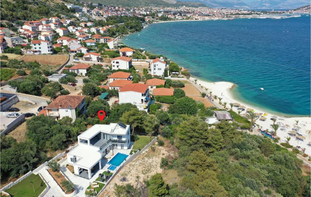 an aerial view of a house next to a beach at Lovely Home In Seget Donji in Trogir