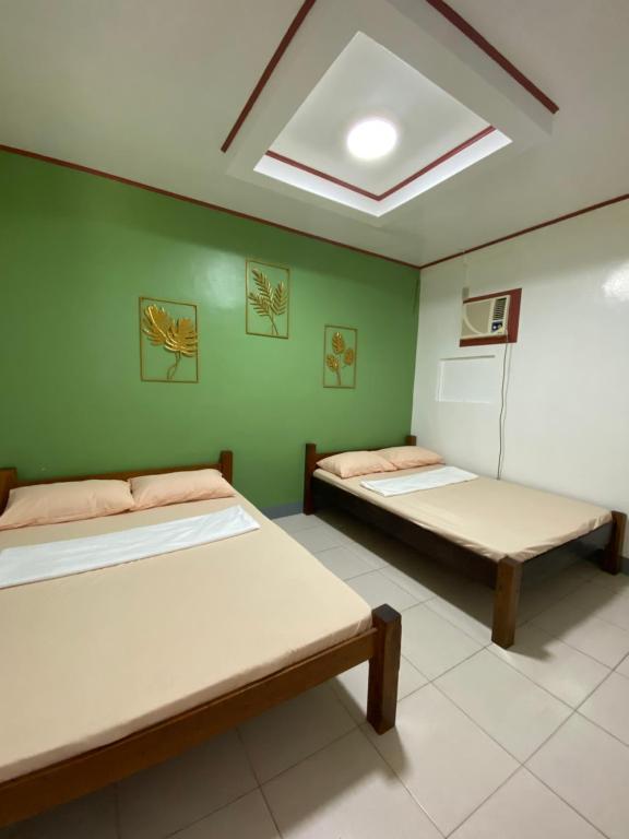Postel nebo postele na pokoji v ubytování Em's Homestay