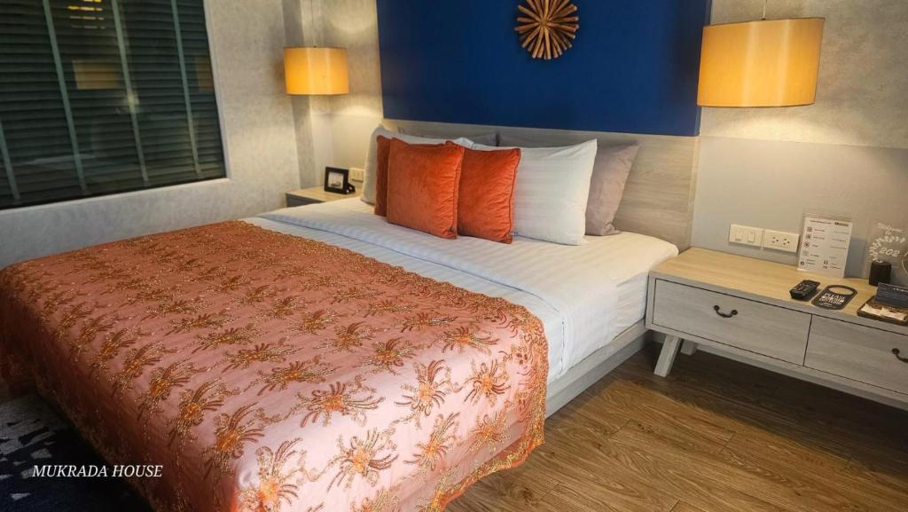Postel nebo postele na pokoji v ubytování Mukrada House Boutique Hometel Krabi