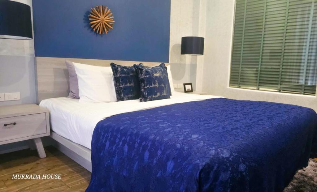 Postel nebo postele na pokoji v ubytování Mukrada House Boutique Hometel Krabi