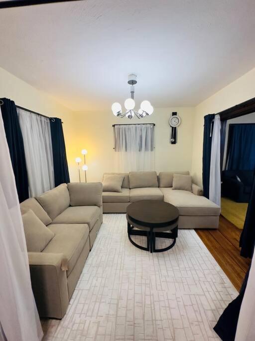 a living room with a couch and a table at Home besides Niagara Falls, NY in Niagara Falls