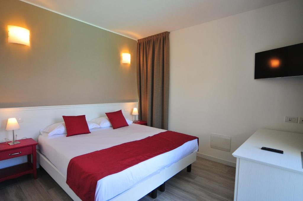 Postel nebo postele na pokoji v ubytování Hotel Resort Le Vele