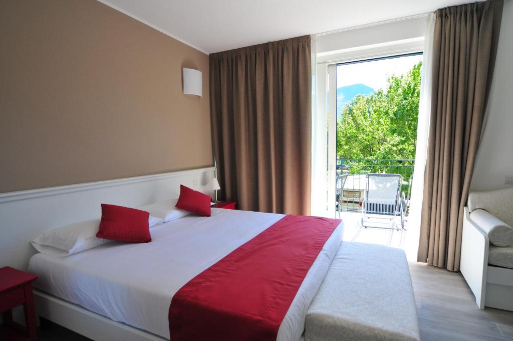 Postel nebo postele na pokoji v ubytování Hotel Resort Le Vele