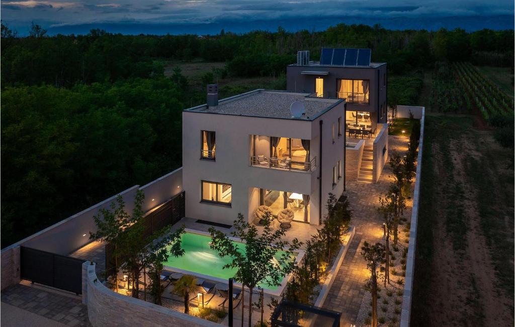 an aerial view of a house with lights at Villa Tina in Privlaka