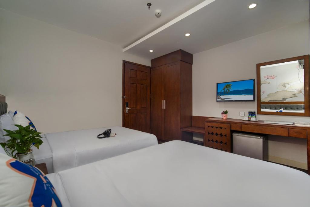 TV a/nebo společenská místnost v ubytování Delicate Hotel