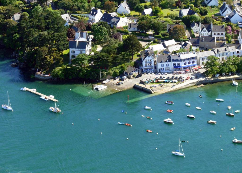 an aerial view of a harbor with boats in the water at Hotel Du Bac in Combrit