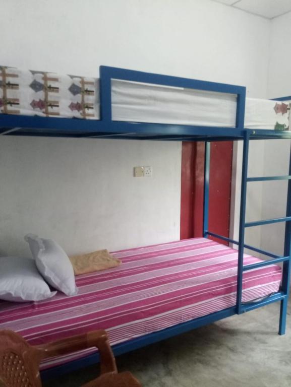 Postel nebo postele na pokoji v ubytování EECS Transit and Budget Homestay