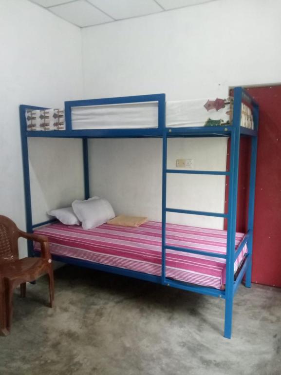 Postel nebo postele na pokoji v ubytování EECS Transit and Budget Homestay