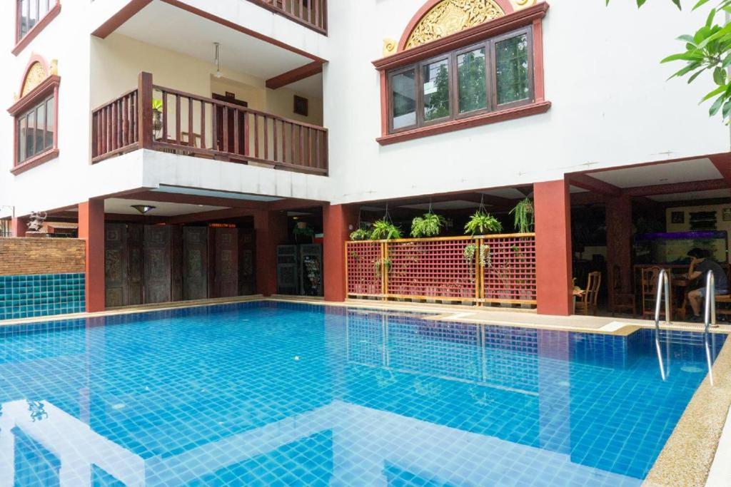 a swimming pool in front of a house at SK House 2 in Chiang Mai