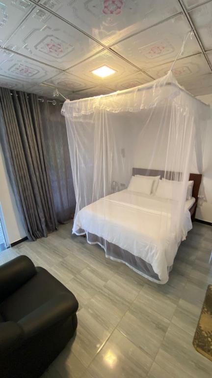Postel nebo postele na pokoji v ubytování Cinnamon Homestay ella