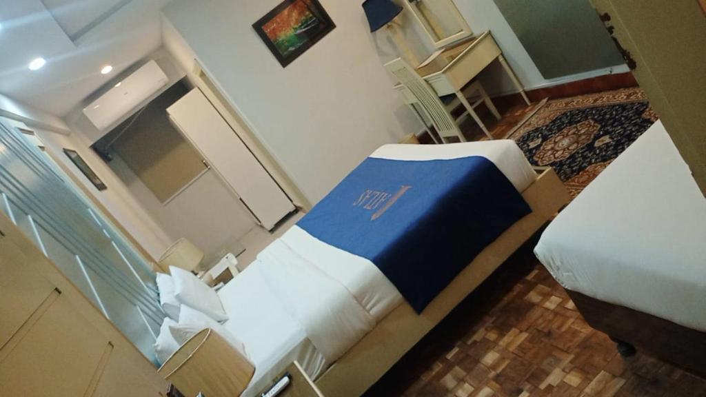 Postel nebo postele na pokoji v ubytování Atlas Hotel Islamabad