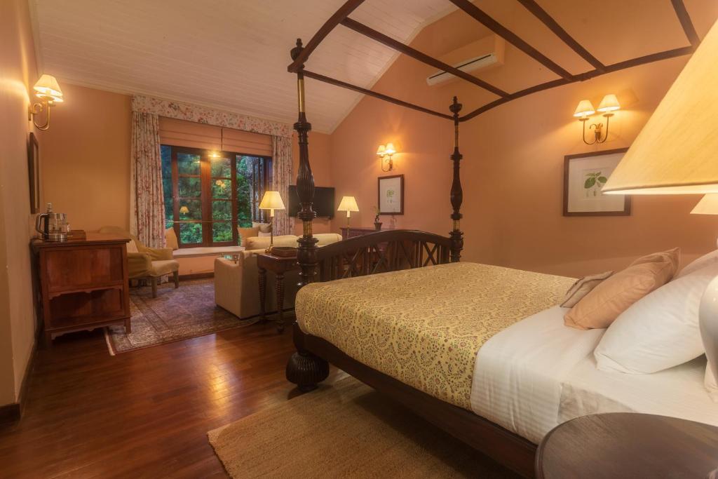 Postel nebo postele na pokoji v ubytování Kandy Dendrobium House