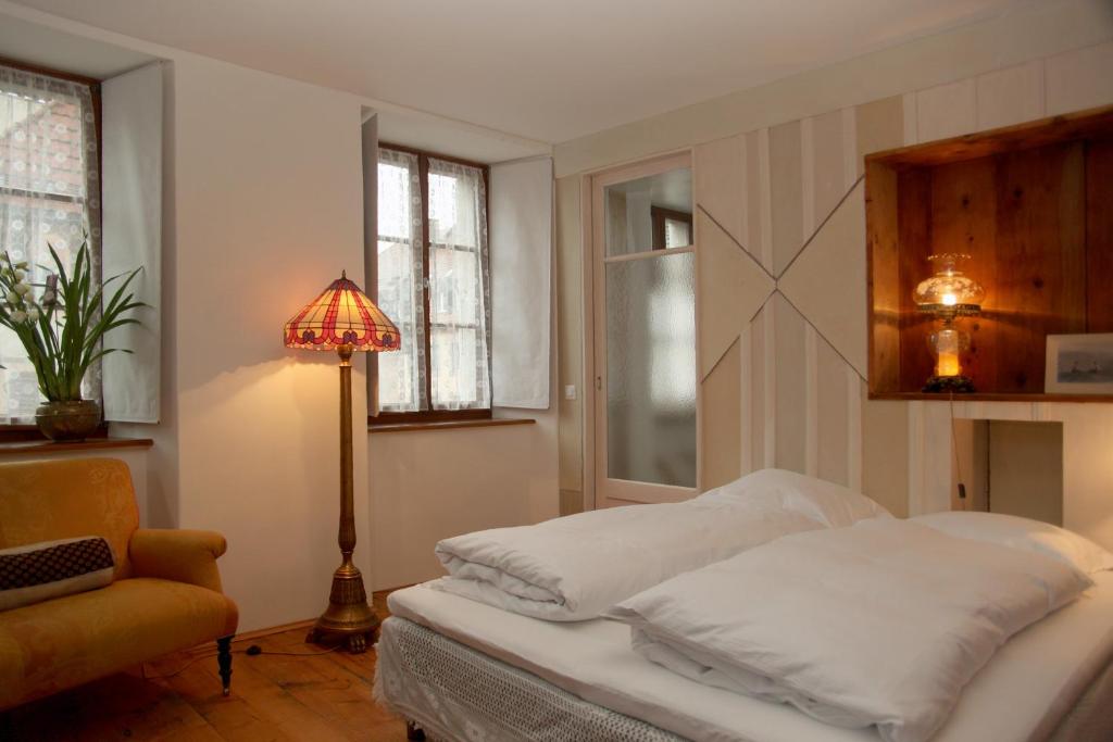 Postel nebo postele na pokoji v ubytování Boutique-Hotel Guesthouse Le Locle