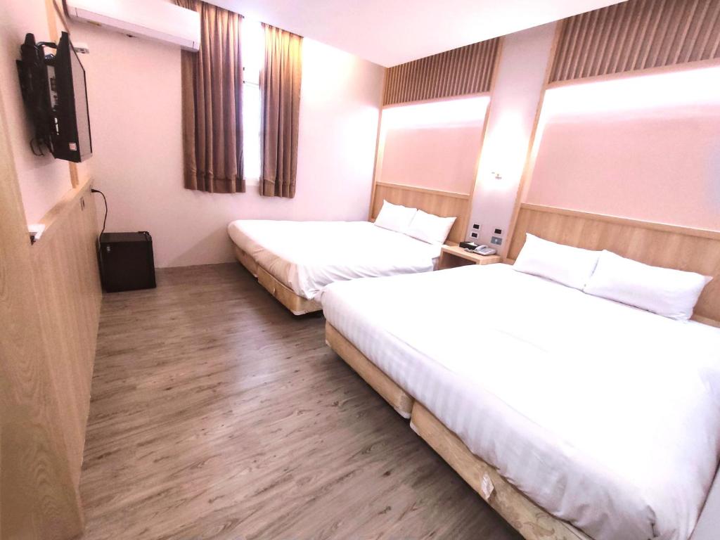 Postel nebo postele na pokoji v ubytování AOIKE Hot Spring Hotel