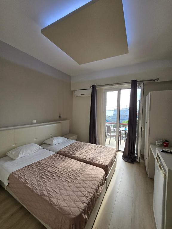 Posteľ alebo postele v izbe v ubytovaní Aegean Sea Rooms