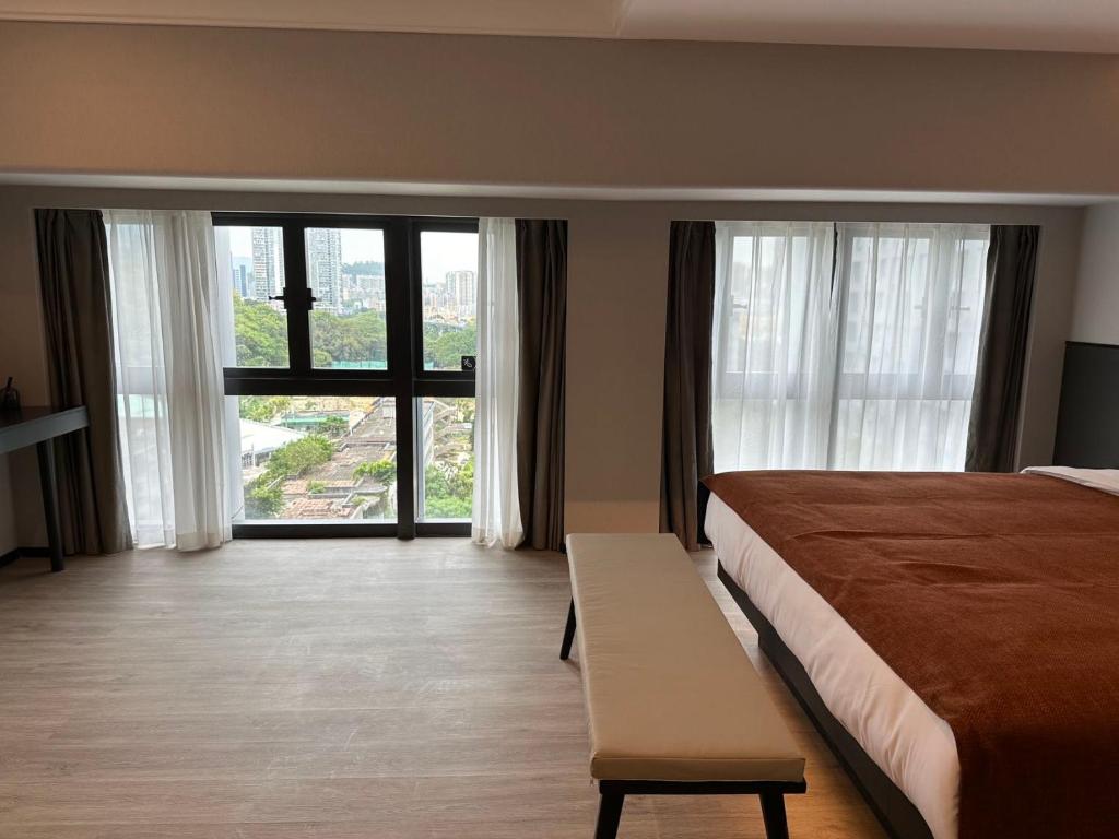 Postel nebo postele na pokoji v ubytování LlA Hotel Liang Jun Plaza, Xixiang Avenue