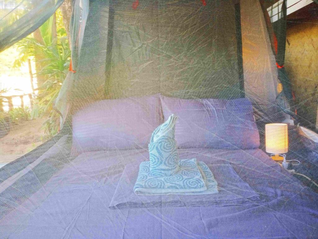 Postel nebo postele na pokoji v ubytování Amwani Breeze