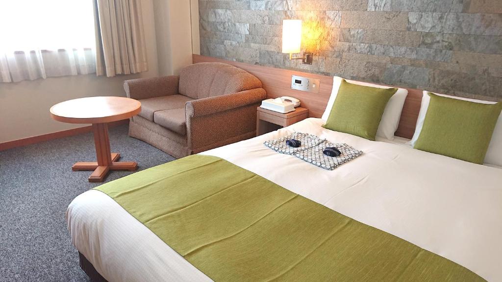 Postel nebo postele na pokoji v ubytování West Inn Fuji-Yoshida