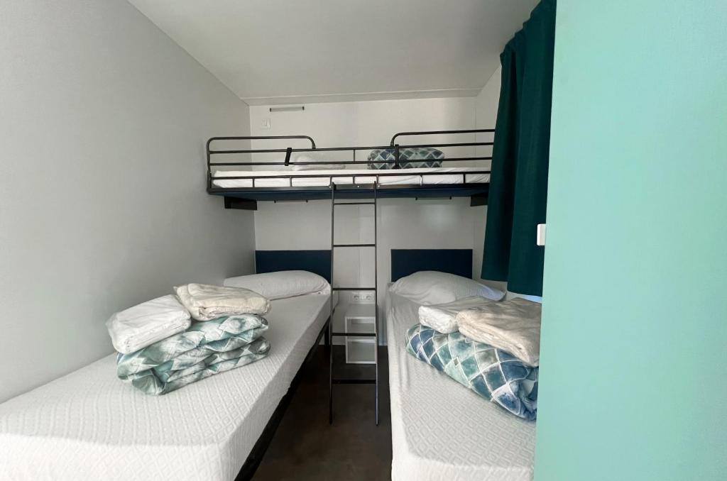 Postel nebo postele na pokoji v ubytování Camping Village Capo D'Orso