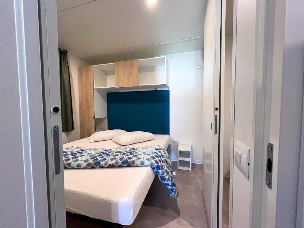 Postel nebo postele na pokoji v ubytování Camping Village Capo D'Orso