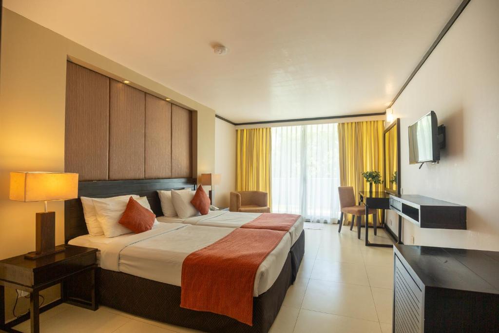 Postel nebo postele na pokoji v ubytování Pegasus Reef - A Beach Resort in Colombo