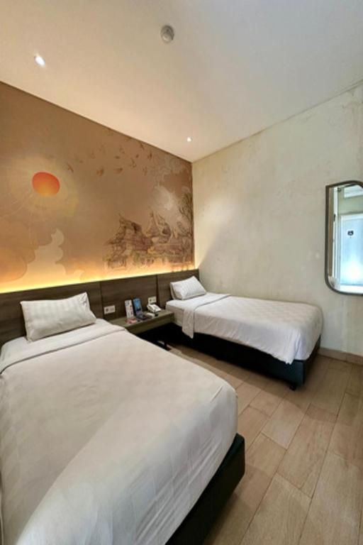 Postel nebo postele na pokoji v ubytování Hotel 88 Alun Alun Bandung By WH