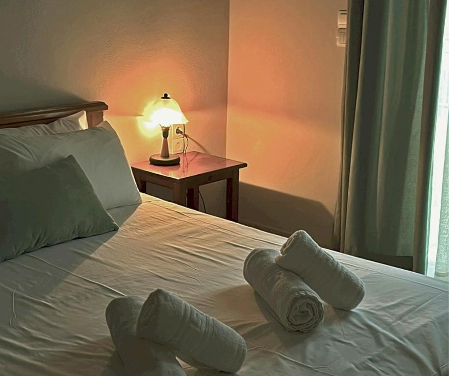 A bed or beds in a room at Panos Village