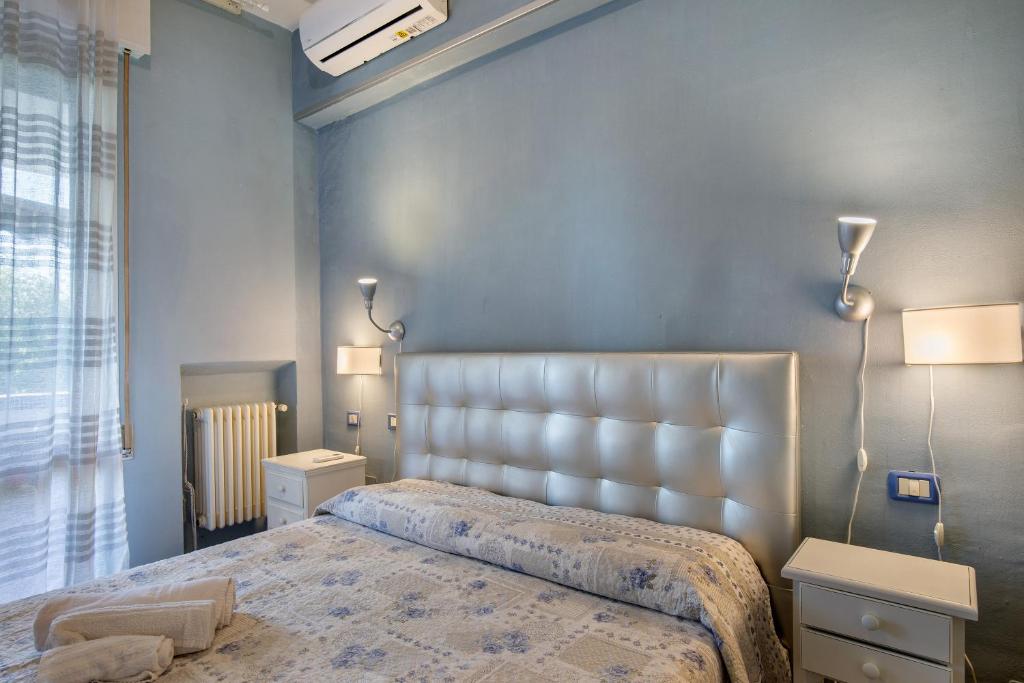 Posteľ alebo postele v izbe v ubytovaní Best Relax Home Marina Di Carrara