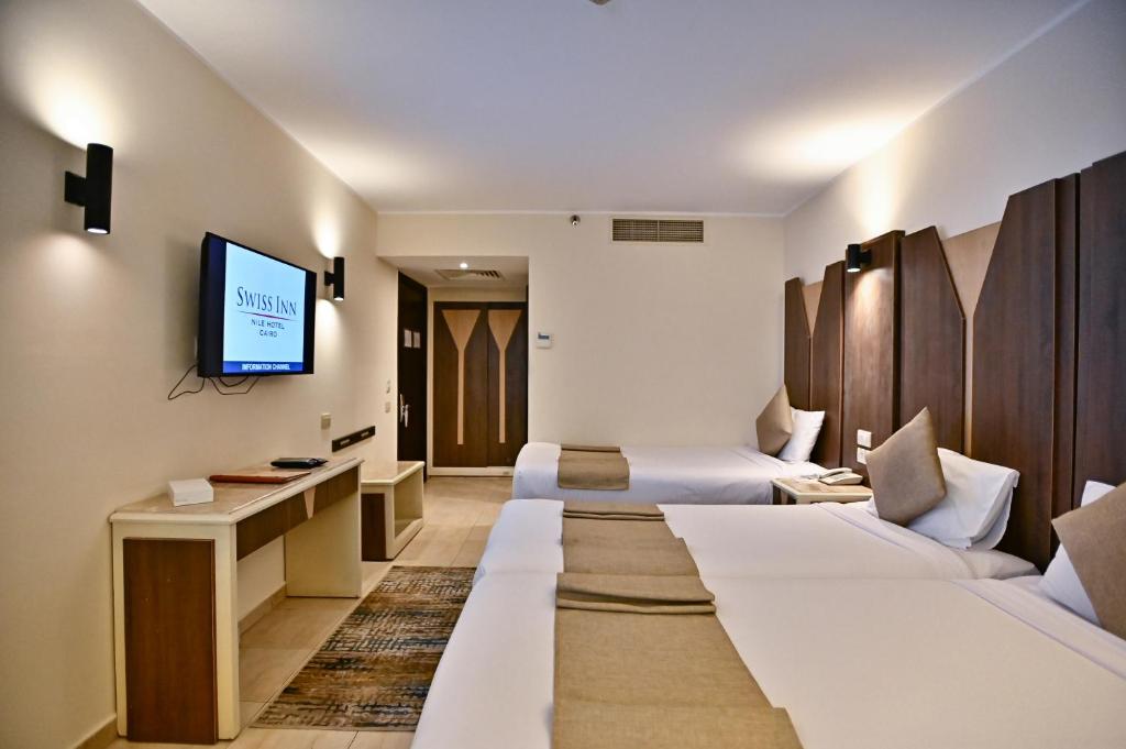 TV a/nebo společenská místnost v ubytování Swiss Inn Nile Hotel